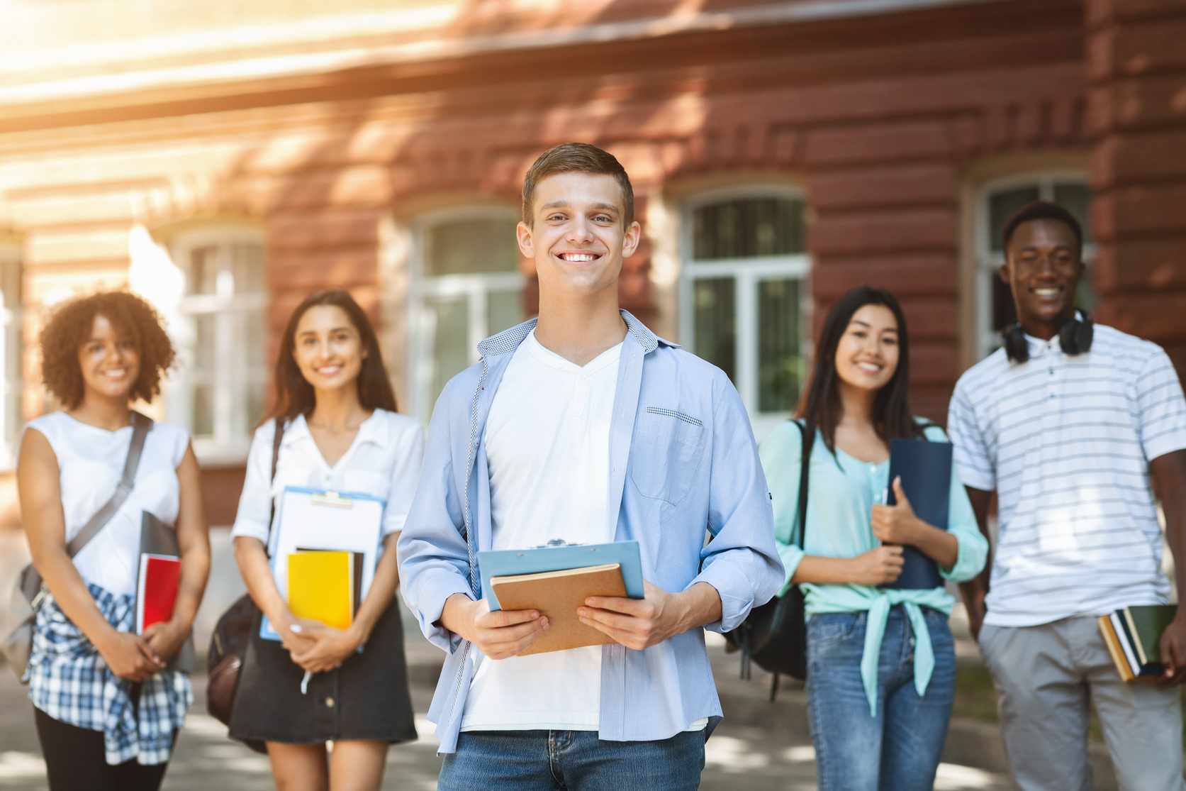 Young Adults Posing Outdoors in Their University Campus